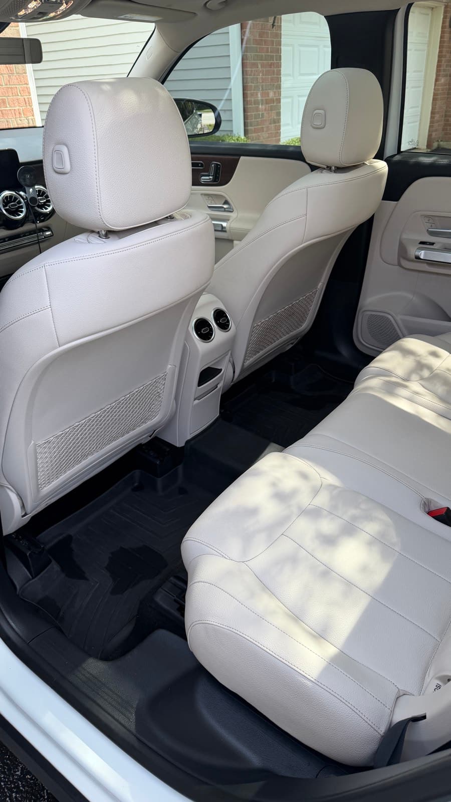 Clean cream leather back seats of a Mercedes GLB detailed by Neat Touch Auto Spa